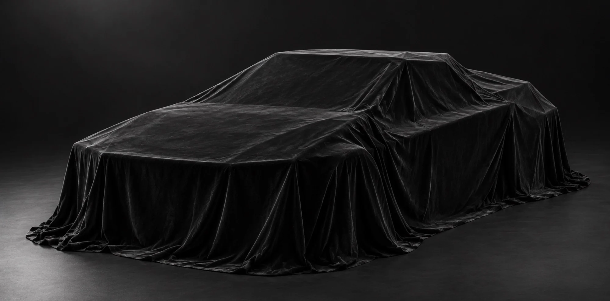 CyberPlaid under a black velvet cover in a dark studio