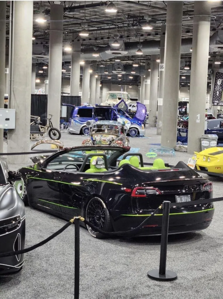 Roofless Tesla project: black Tesla Model 3 convertible with lime green interior at the LA Auto Show