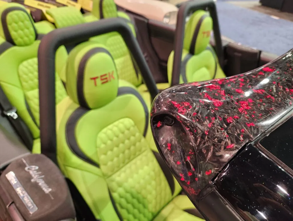 Roofless Tesla project: lime green TSK-embroidered seats and red-flecked forged carbon trim in the open cabin