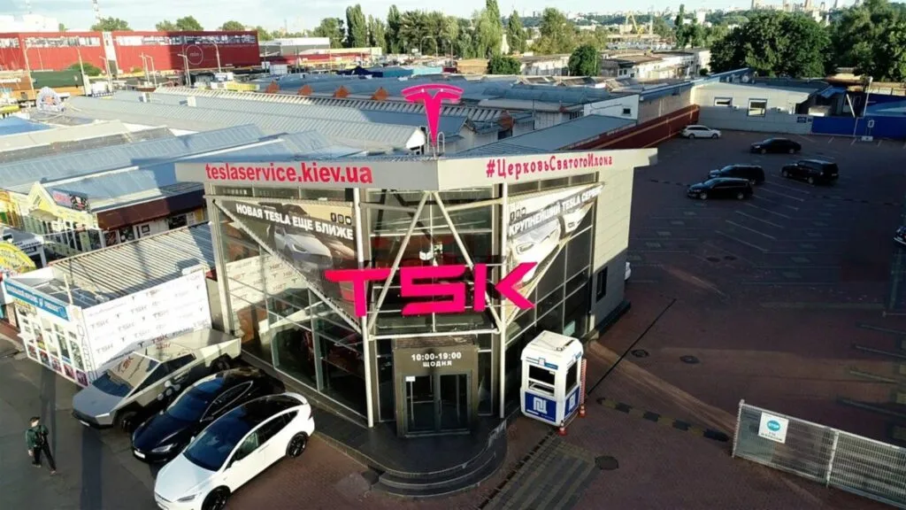 Aerial view of TSK Tesla service center in Kyiv with Cybertruck and Model Y parked outside