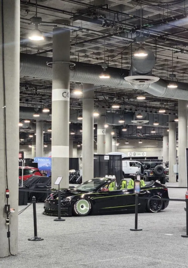 Roofless Tesla project: black Tesla Model 3 convertible with green seats and TSK wheel covers at the LA Auto Show