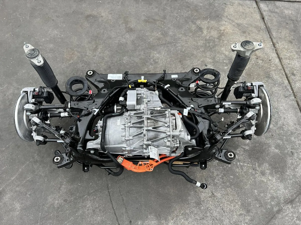 Tesla Model Y rear subframe with drive unit removed for bearing service at TSK