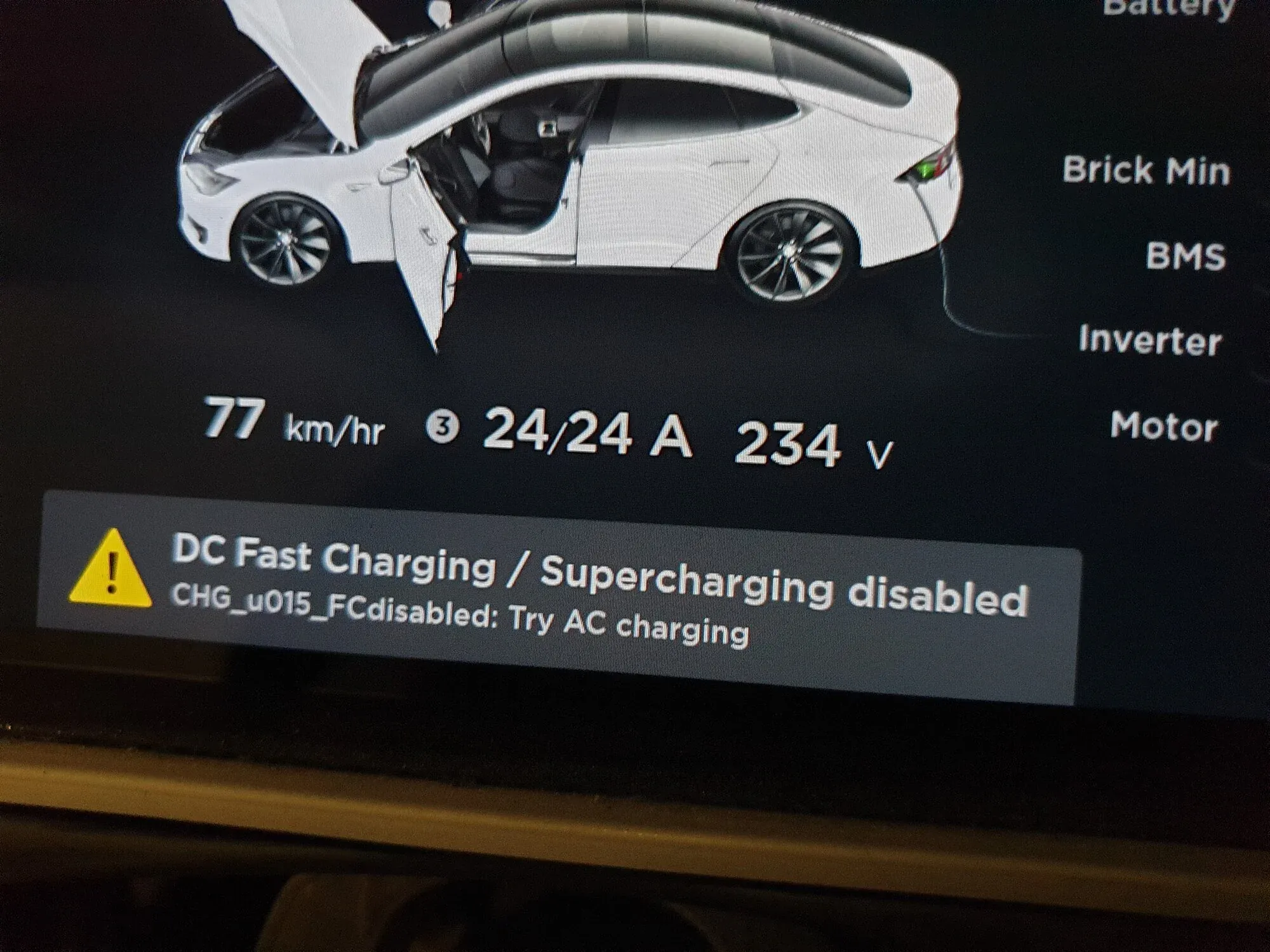 Tesla Model X touchscreen showing DC Fast Charging/Supercharging disabled warning during service