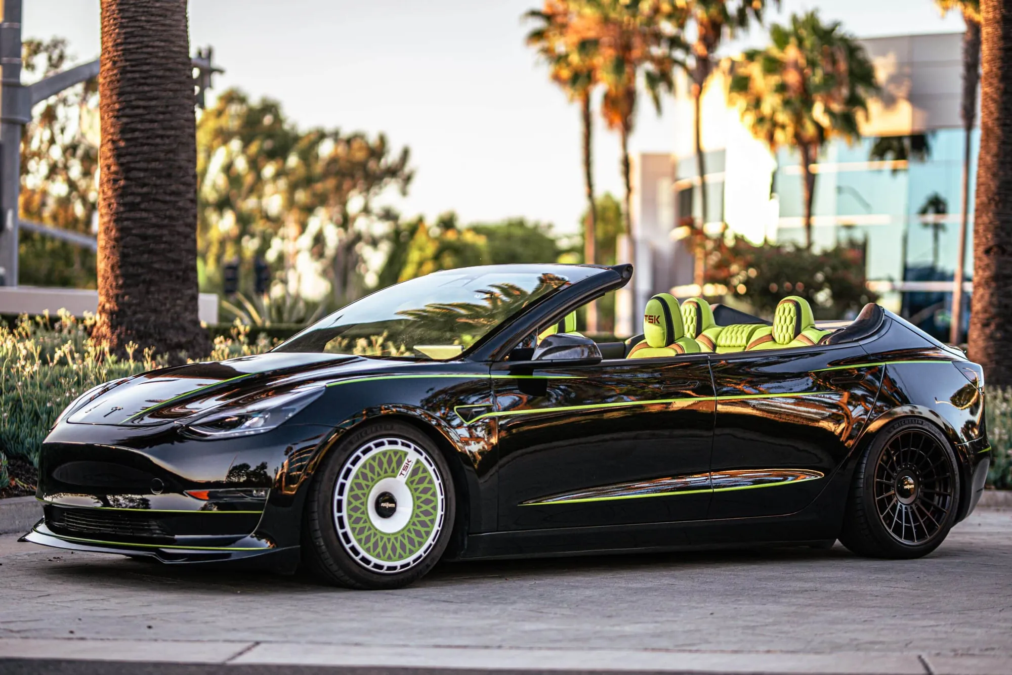 Roofless Tesla project: black Tesla Model 3 with no roof, lime green interior and matching green accents