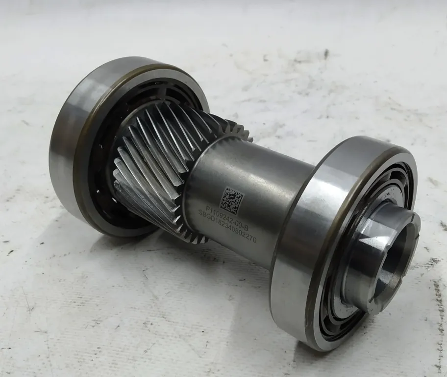 Tesla drive unit gear shaft with bearings, serviced at TSK Cypress