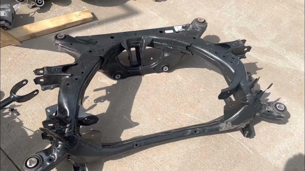 Tesla Model 3 rear subframe removed for suspension replacement at TSK repair shop