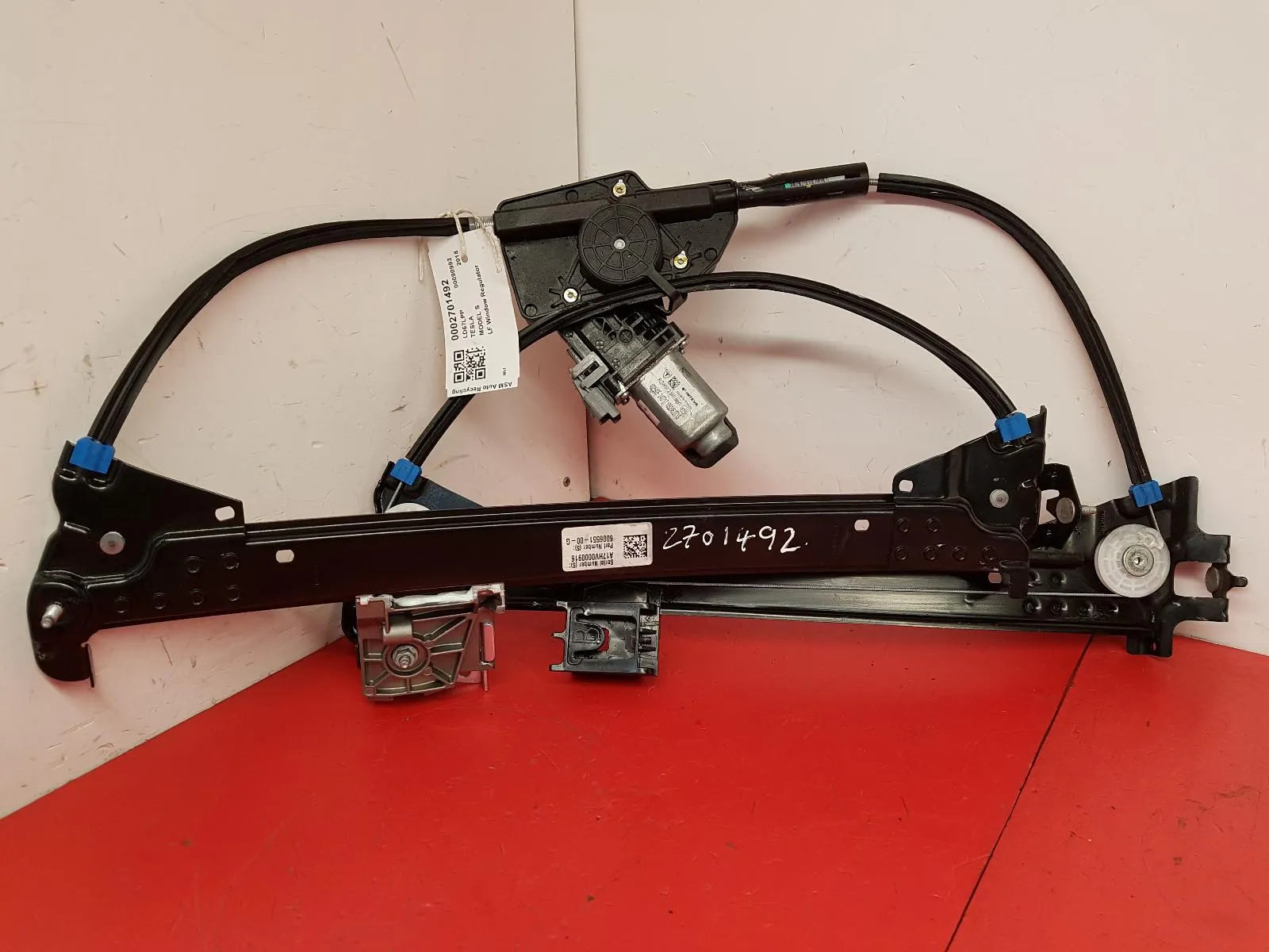 Tesla Model S window regulator with motor removed for repair at TSK