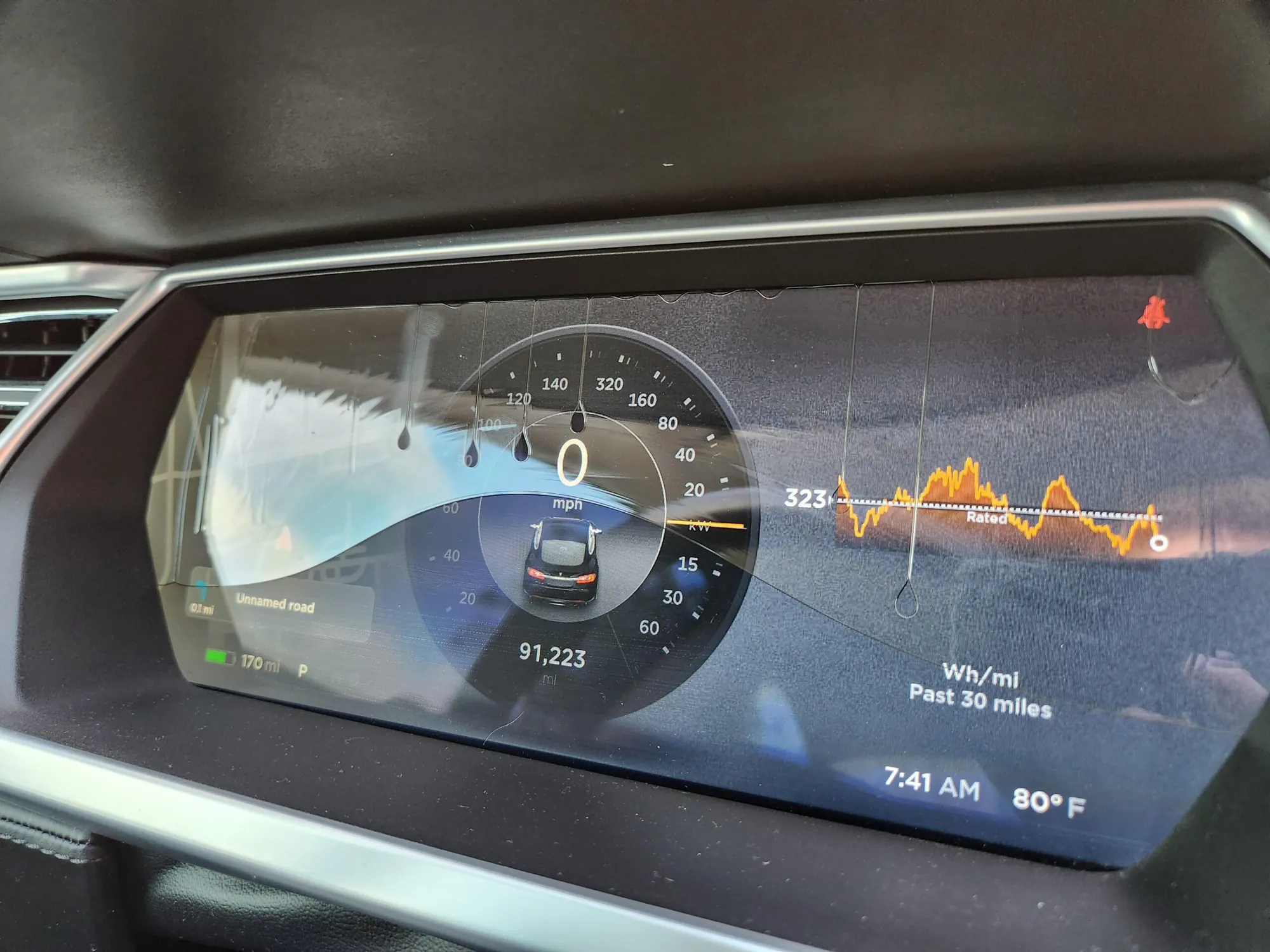 Tesla Model S instrument cluster with moisture leaking behind cracked display screen