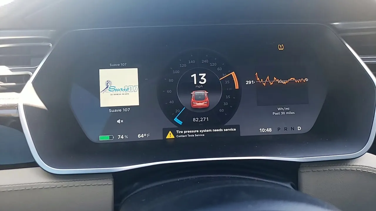 Tesla Model S dashboard showing tire pressure system needs service warning message