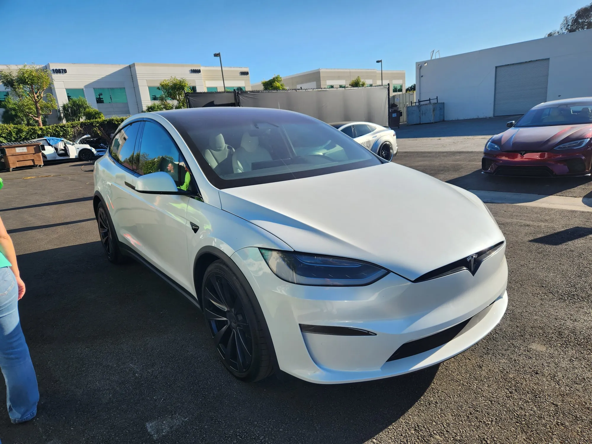 White Tesla Model X parked in lot after body repair at TSK