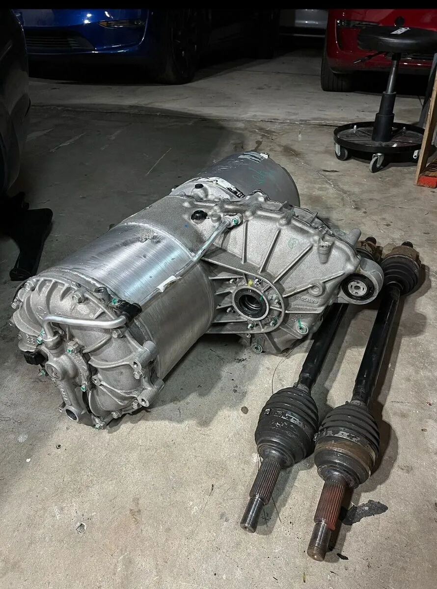 Tesla Model X drive unit and CV axles removed for bearing replacement at TSK