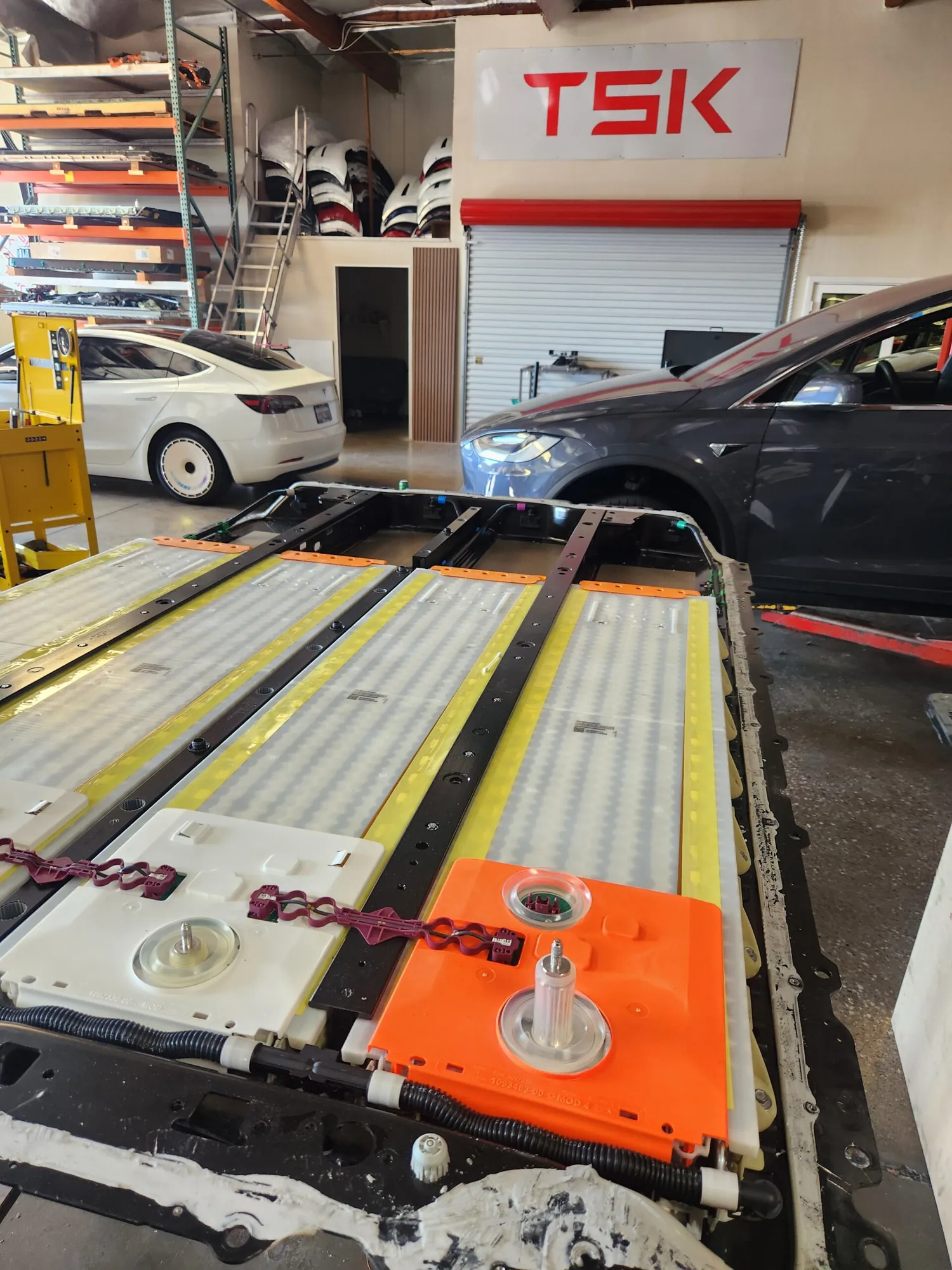 Tesla Model X high-voltage battery pack removed for service at TSK shop