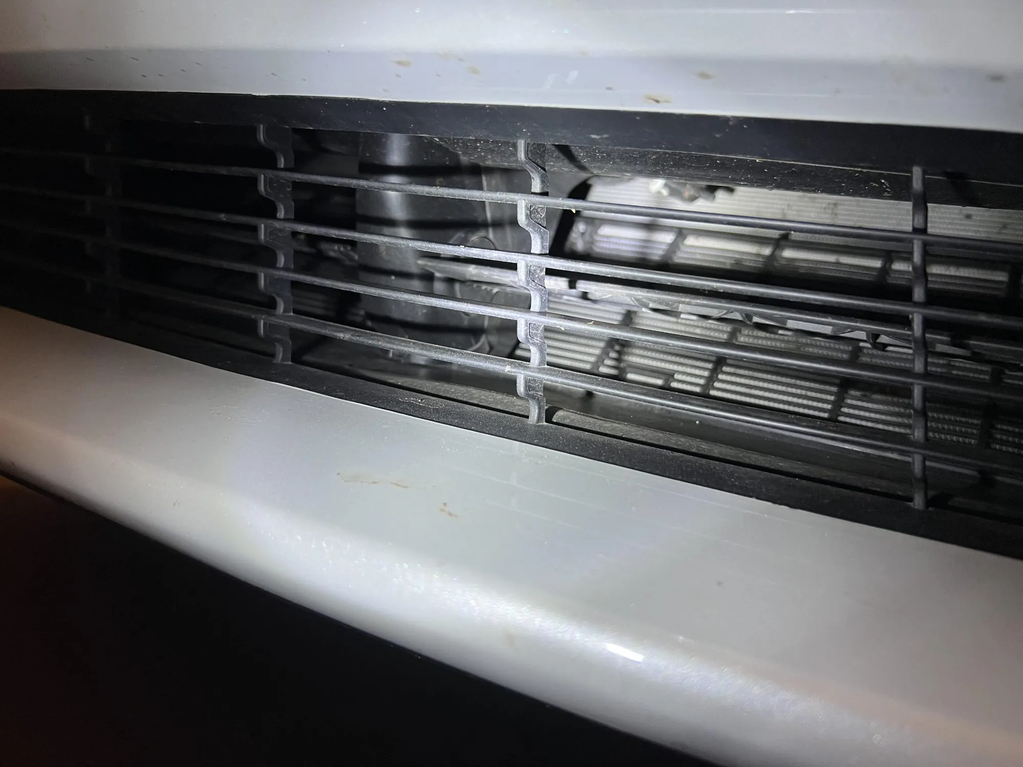 Close-up of Tesla Model X dashboard vent louvers during HVAC inspection at TSK