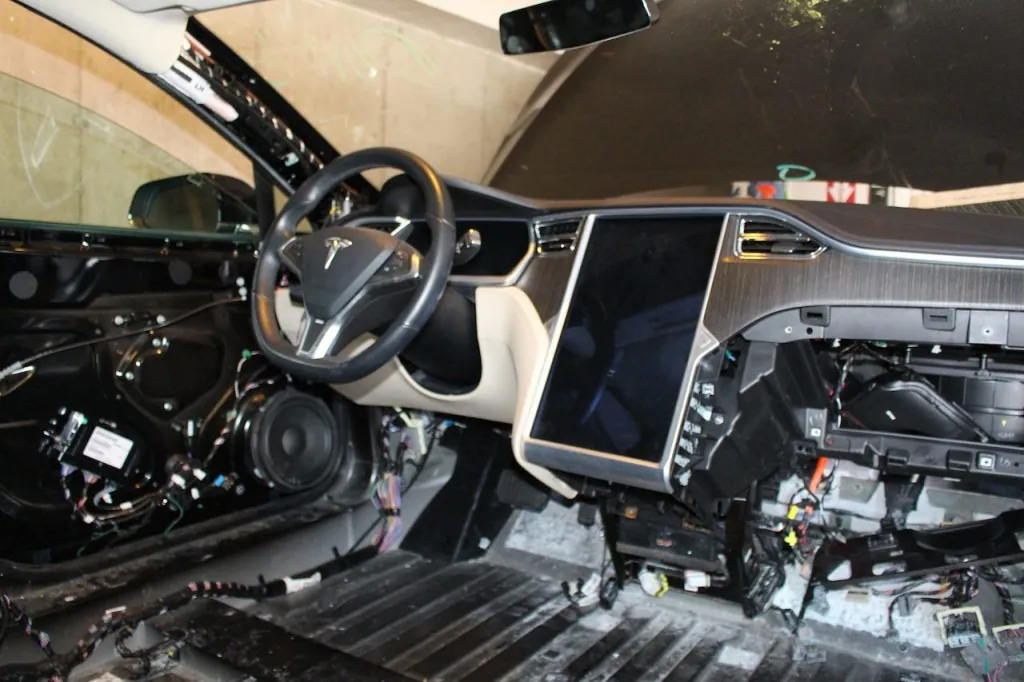 Tesla Model X dashboard disassembled for MCU screen repair and programming
