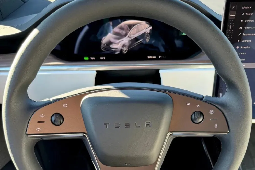 Tesla Model X steering wheel and dashboard, focus of suspension and steering service