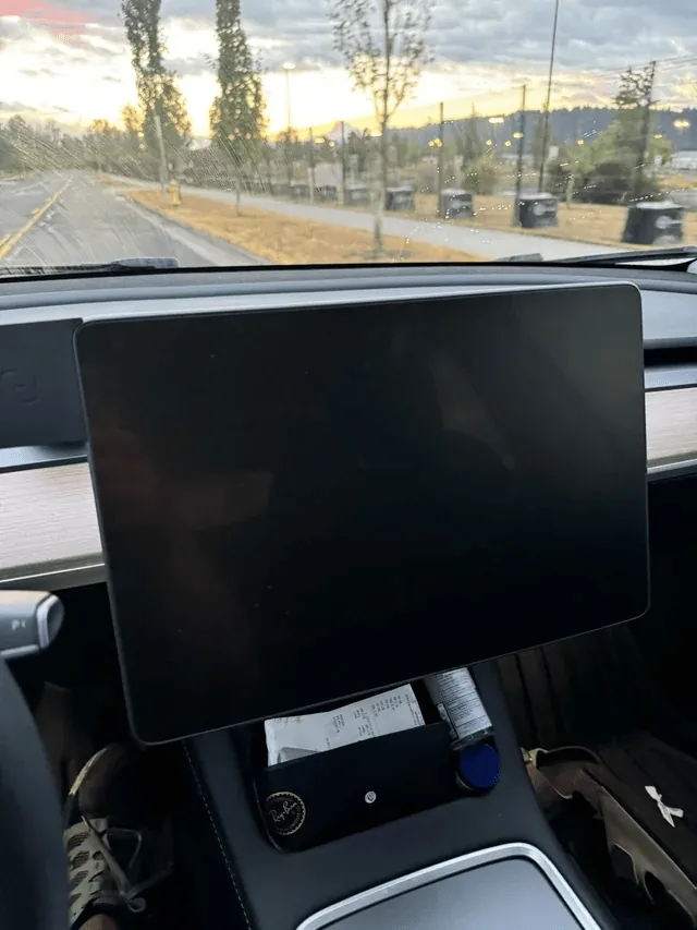 Tesla Model Y interior with blank MCU touchscreen before programming service