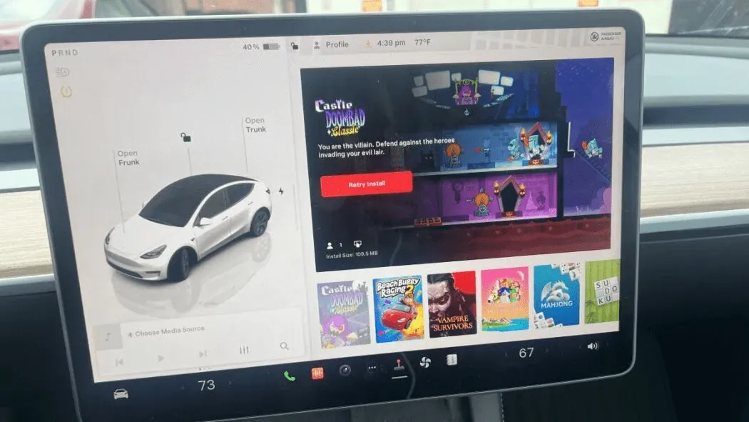 Tesla Model Y touchscreen showing games menu after software programming at TSK Cypress