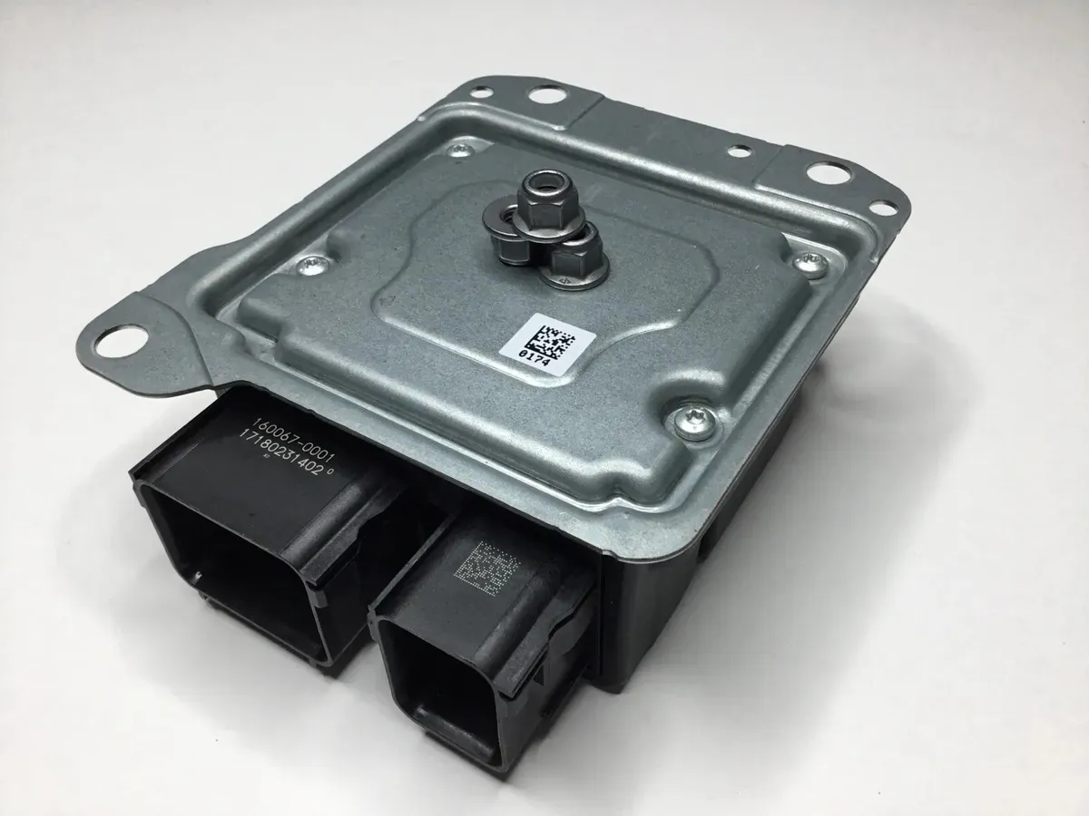Tesla control module with electrical connectors, replaced during TSK programming service