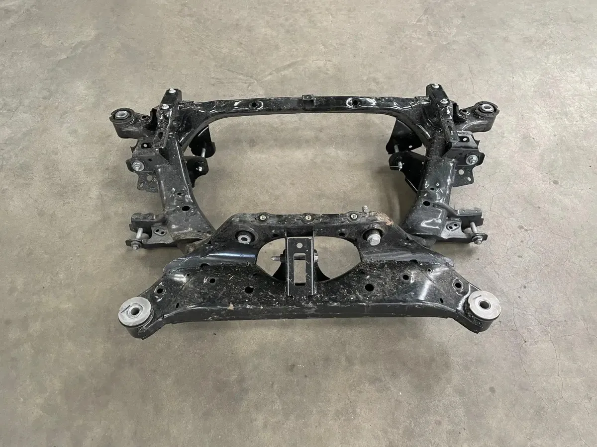 Tesla front subframe assembly removed for suspension repair at TSK