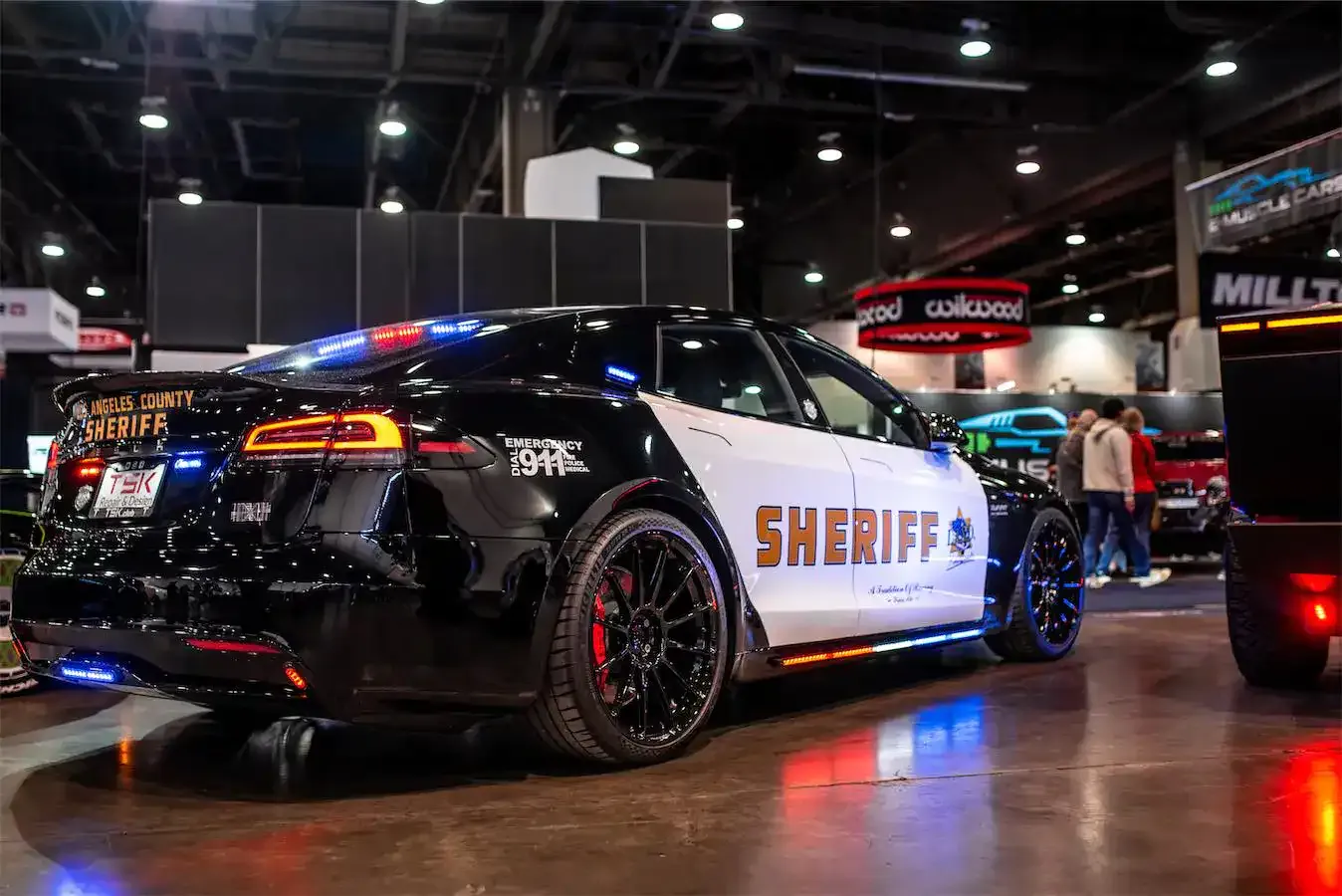 Police Interceptor project: Los Angeles County Sheriff-themed Tesla Model S with black wheels at an auto show