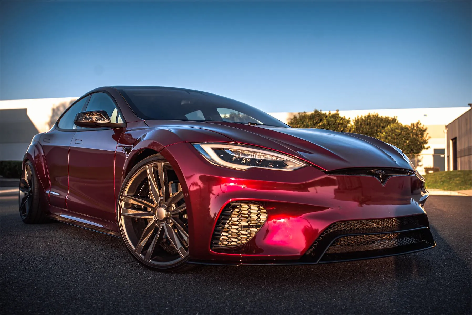 Wild Tesla project: red Tesla Model S widebody with its custom front bumper